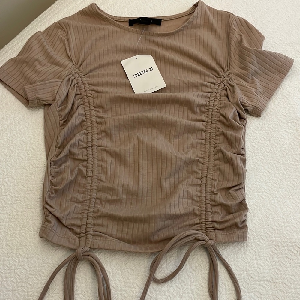 Forever 21 size small. New. Never worn taupe color